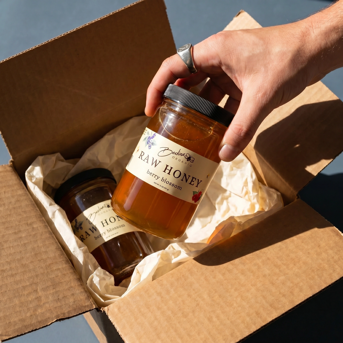32-ounce Berry Blossom raw honey jar from Beeline Organic Honey
