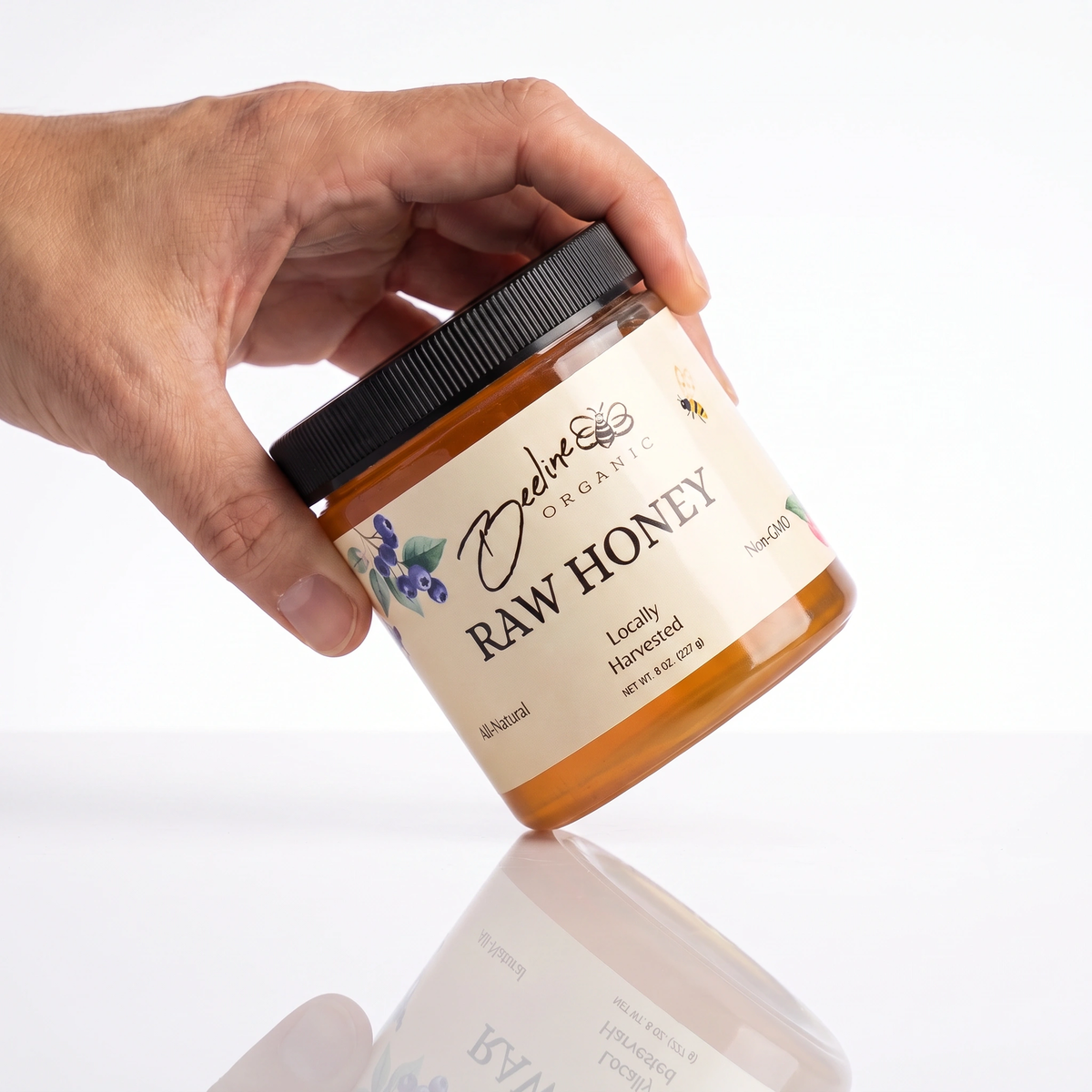8-ounce Berry Blossom raw honey jar from Beeline Organic Honey