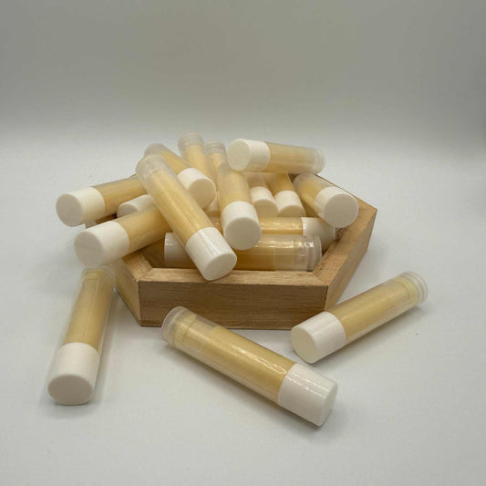 Handmade peppermint beeswax lip balm infused with raw honey by Beeline Organic.