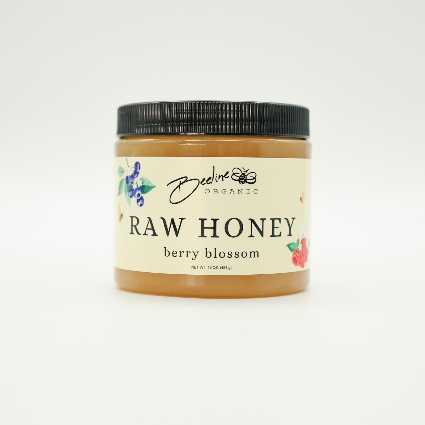 16oz jar of Beeline Organic Raw Berry Blossom Honey from Bellingham Washington.