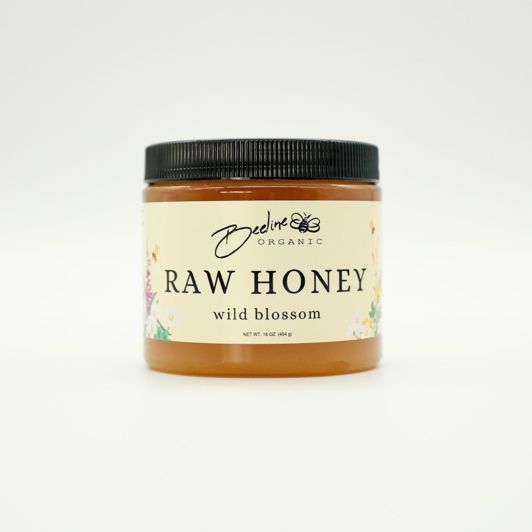 16oz jar of Beeline Organic Raw Wild Blossom Honey from Washington Mountains.